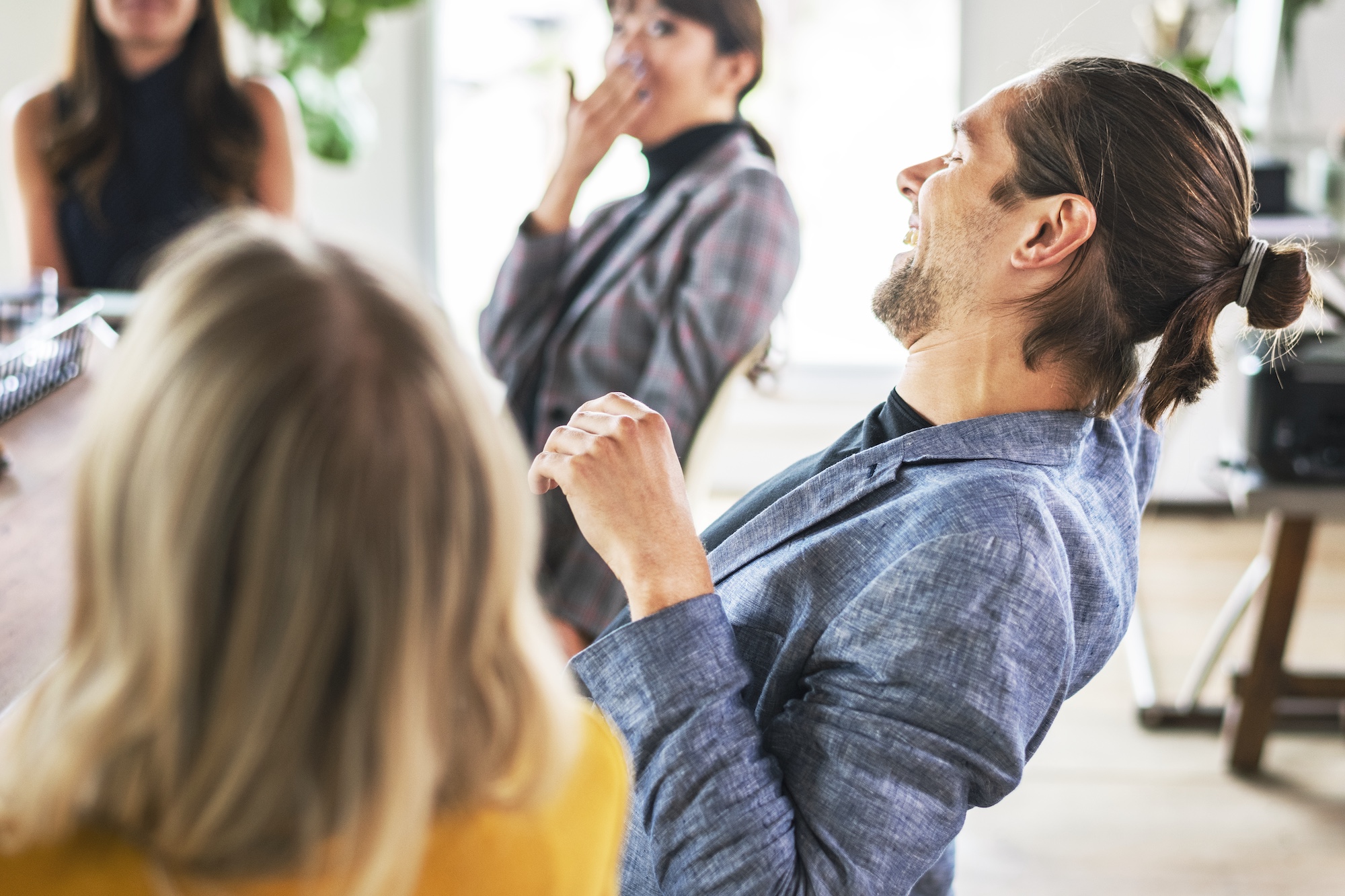 People in a meeting discussing brand strategy